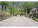 A peaceful backyard featuring a large covered swimming pool surrounded by lush trees at 110 Emerald Dr, Mcdonough, GA 30253