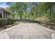 Large rectangular in-ground pool with a safety cover amidst a serene, wooded backyard at 110 Emerald Dr, Mcdonough, GA 30253