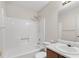 Bathroom featuring a shower-tub combination, sink, and a mirror at 1220 Paddocks Way, Powder Springs, GA 30127
