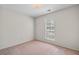 Bright bedroom with a window allowing for natural light and ventilation at 1220 Paddocks Way, Powder Springs, GA 30127