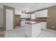Bright kitchen featuring white cabinets and an island at 1220 Paddocks Way, Powder Springs, GA 30127