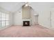 Spacious living room featuring a cozy fireplace and vaulted ceilings at 1220 Paddocks Way, Powder Springs, GA 30127