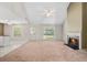 Bright living room features vaulted ceilings, fireplace, and windows at 1220 Paddocks Way, Powder Springs, GA 30127
