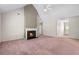 Open concept living room featuring a cozy fireplace at 1220 Paddocks Way, Powder Springs, GA 30127