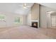 Inviting living room featuring a cozy fireplace and vaulted ceilings at 1220 Paddocks Way, Powder Springs, GA 30127
