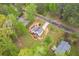 Bird's-eye view of home featuring manicured landscaping and an expansive driveway at 128 Partridge Rdg, Woodstock, GA 30188