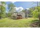 Expansive backyard featuring a deck, patio, and lush greenery, perfect for outdoor enjoyment at 128 Partridge Rdg, Woodstock, GA 30188
