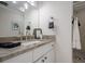 This stylish bathroom has a vanity with marble countertop and a tiled shower at 128 Partridge Rdg, Woodstock, GA 30188