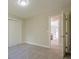 This bedroom has neutral walls, plush carpet, closet, and is move-in ready at 128 Partridge Rdg, Woodstock, GA 30188