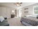 This lovely bedroom has a seating area, closet, neutral walls, and plush carpet at 128 Partridge Rdg, Woodstock, GA 30188