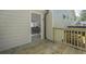 An open door from the deck gives a glimpse into the home's interior, highlighting the connection to living space at 128 Partridge Rdg, Woodstock, GA 30188