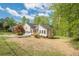 Charming two-story home with a manicured lawn, and a welcoming red front door at 128 Partridge Rdg, Woodstock, GA 30188