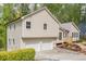 A well-maintained home featuring an attached two-car garage with a meticulously landscaped front yard at 128 Partridge Rdg, Woodstock, GA 30188