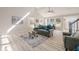 Sunlit living room with a comfortable seating area, vaulted ceilings, and large windows at 128 Partridge Rdg, Woodstock, GA 30188