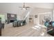 Spacious living area features a fireplace, and an open layout ideal for entertaining at 128 Partridge Rdg, Woodstock, GA 30188