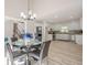 Bright living room and kitchen features large windows and open floorplan at 128 Partridge Rdg, Woodstock, GA 30188