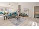 Bright, open-concept living room with vaulted ceilings and stylish modern furnishings at 128 Partridge Rdg, Woodstock, GA 30188