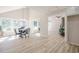 Bright living room and kitchen features large windows and open floorplan at 128 Partridge Rdg, Woodstock, GA 30188