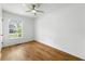 Cozy bedroom featuring hardwood floors and a ceiling fan at 1917 Connally Dr, Atlanta, GA 30344