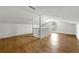 Spacious bonus room with wood floors, a large window for natural light, and a white banister at 1917 Connally Dr, Atlanta, GA 30344