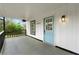 Inviting front porch with blue door and black railing, offering a charming entrance to the home at 1917 Connally Dr, Atlanta, GA 30344