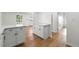 Hallway area showcasing hardwood floors and white cabinetry at 1917 Connally Dr, Atlanta, GA 30344