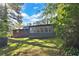 Spacious backyard showcasing lush green lawn and a home with ample windows for natural light at 3137 Ardley Sw Rd, Atlanta, GA 30311