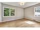 Bright bedroom featuring hardwood floors, neutral walls, and two windows offering natural light at 3137 Ardley Sw Rd, Atlanta, GA 30311
