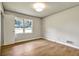 Bedroom with hardwood floors, neutral colored walls, and a ceiling light at 3137 Ardley Sw Rd, Atlanta, GA 30311