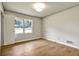 Bedroom features a hardwood floor, a window, and neutral walls at 3137 Ardley Sw Rd, Atlanta, GA 30311