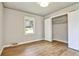 This sunlit bedroom offers hardwood floors and a closet at 3137 Ardley Sw Rd, Atlanta, GA 30311