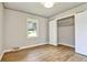 Bedroom featuring hardwood floors, closet and a window at 3137 Ardley Sw Rd, Atlanta, GA 30311