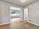 Bright dining room featuring hardwood floors, a modern chandelier, and seamless access to other rooms at 3137 Ardley Sw Rd, Atlanta, GA 30311