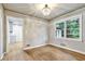Elegant dining room featuring hardwood floors, a stylish chandelier, and ample natural light at 3137 Ardley Sw Rd, Atlanta, GA 30311