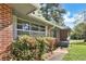 A charming brick home with lush greenery and a quaint porch entrance, creating a cozy curb appeal at 3137 Ardley Sw Rd, Atlanta, GA 30311