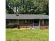 Charming brick home with a well-maintained lawn and mature trees at 3137 Ardley Sw Rd, Atlanta, GA 30311
