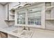 Charming kitchen with a double basin sink beneath a window offering plenty of natural light at 3137 Ardley Sw Rd, Atlanta, GA 30311
