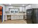 Functional kitchen equipped with white cabinets and laminate floors, offering a practical cooking space at 3137 Ardley Sw Rd, Atlanta, GA 30311