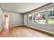 Inviting living room with gleaming hardwood floors, large windows, and a view of the front yard at 3137 Ardley Sw Rd, Atlanta, GA 30311