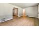 Spacious living room with hardwood floors, neutral paint, and open doorways, great for entertaining at 3137 Ardley Sw Rd, Atlanta, GA 30311