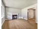 Bright living room featuring hardwood floors and a fireplace, perfect for cozy gatherings and relaxation at 3137 Ardley Sw Rd, Atlanta, GA 30311