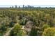 An aerial view shows the home nestled in a leafy neighborhood with city skyline views at 4220 Club Ne Dr, Atlanta, GA 30319