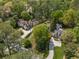 Aerial view showcasing the property's setting amidst lush greenery and neighboring homes at 4220 Club Ne Dr, Atlanta, GA 30319