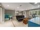 Basement living room featuring neutral color scheme, recessed lighting, and a banquette at 4220 Club Ne Dr, Atlanta, GA 30319