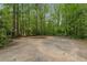 A private basketball court surrounded by trees creates a secluded and sporty outdoor space at 4220 Club Ne Dr, Atlanta, GA 30319