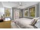Cozy bedroom with a neutral color scheme, large windows, and a ceiling fan at 4220 Club Ne Dr, Atlanta, GA 30319