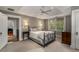 Inviting bedroom featuring a ceiling fan, neutral carpet, and natural light from large windows at 4220 Club Ne Dr, Atlanta, GA 30319