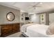 Comfortable bedroom with a dresser, TV, and ample natural light from the large windows at 4220 Club Ne Dr, Atlanta, GA 30319