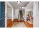 Inviting foyer with gleaming hardwood floors, elegant staircase, and an open view into the living spaces at 4220 Club Ne Dr, Atlanta, GA 30319