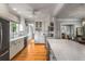 Bright kitchen features white cabinets, marble countertops, stainless appliances, and hardwood flooring at 4220 Club Ne Dr, Atlanta, GA 30319